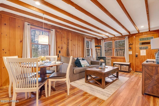 91 Bruin Rd, Lake Ariel, PA 18436 - living area with a wood stove, wooden walls, light wood-type flooring, and beam ceiling