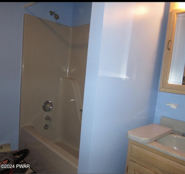 full bathroom with sink, shower / washtub combination, and toilet