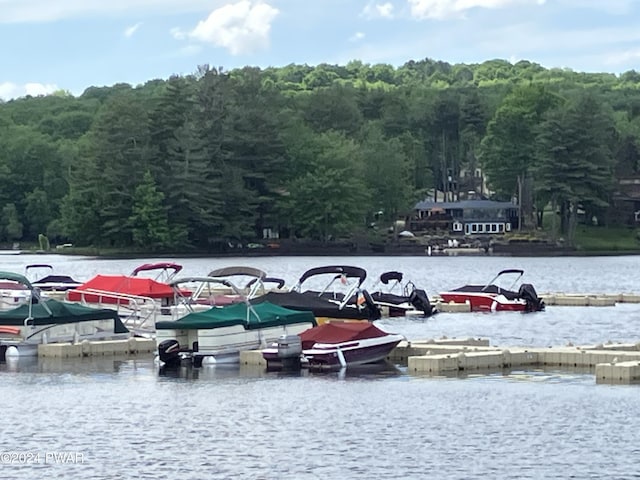 view of parking featuring a water view