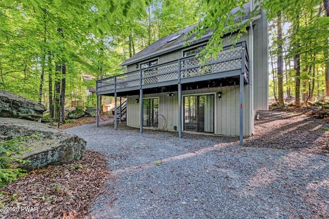 24 Lakewood Dr, Lake Ariel, PA 18436 - back of property with a wooden deck and stairway