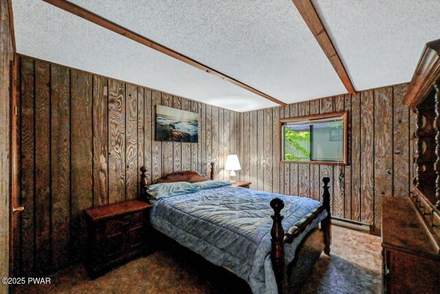 24 Lakewood Dr, Lake Ariel, PA 18436 - bedroom featuring wooden walls, a textured ceiling, carpet floors, and baseboard heating