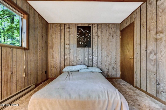 24 Lakewood Dr, Lake Ariel, PA 18436 - carpeted bedroom with a baseboard heating unit and wooden walls