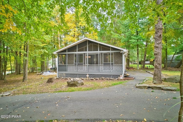 view of front facade featuring a sunroom