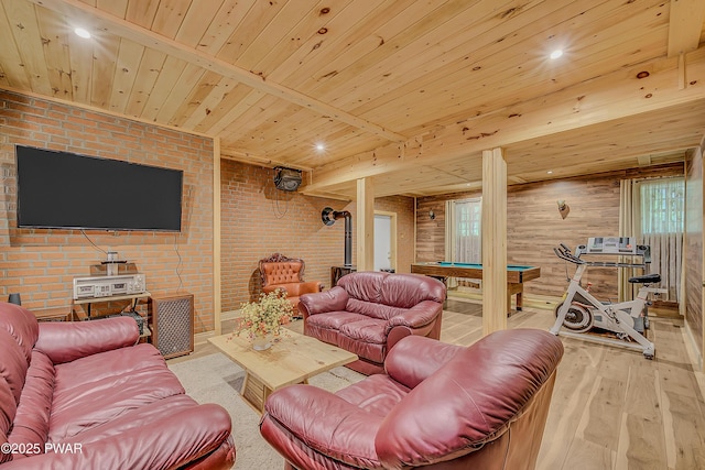 2106 Blueberry Ct, Bushkill, PA 18324 - living area featuring a wood stove, billiards table, wooden ceiling, light wood-style floors, and brick wall