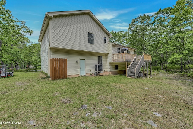 2106 Blueberry Ct, Bushkill, PA 18324 - rear view of house with stairs, a deck, and a yard