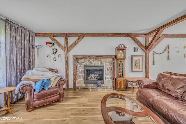 2106 Blueberry Ct, Bushkill, PA 18324 - living room featuring light wood-style floors and a stone fireplace