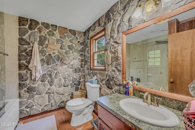2106 Blueberry Ct, Bushkill, PA 18324 - full bath featuring vanity, wood finished floors, vaulted ceiling, and combined bath / shower with glass door