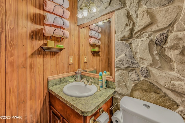 2106 Blueberry Ct, Bushkill, PA 18324 - bathroom featuring vanity and wood walls