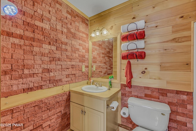 2106 Blueberry Ct, Bushkill, PA 18324 - bathroom with vanity, brick wall, and wood walls