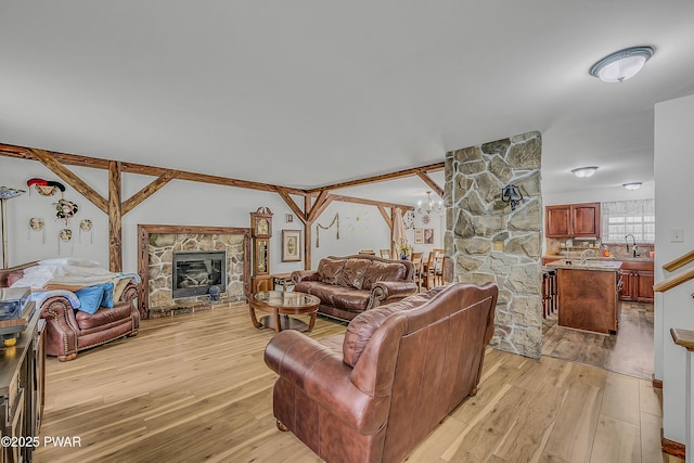 2106 Blueberry Ct, Bushkill, PA 18324 - living room with light wood finished floors and a fireplace