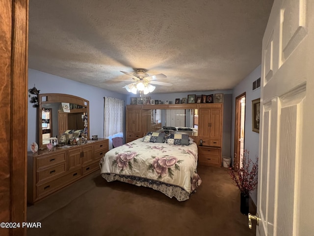 bedroom with carpet flooring, ceiling fan, and a textured ceiling