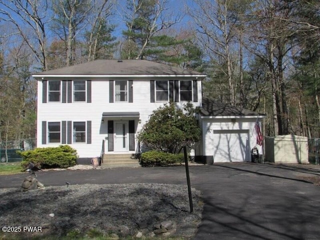 102 Yvonne Ct, Dingmans Ferry, PA 18328 - colonial house with an outdoor structure and aphalt driveway