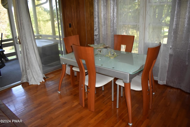 dining room featuring hardwood / wood-style floors and plenty of natural light