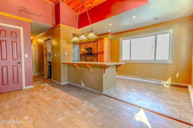 kitchen featuring a baseboard radiator, black microwave, crown molding, and baseboards