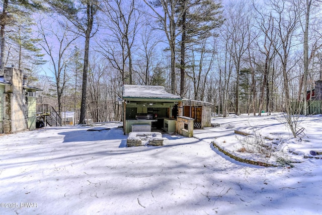 view of yard layered in snow