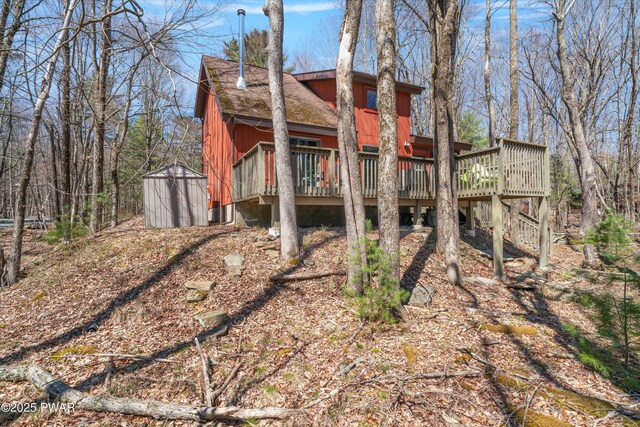 105 Tupelo Dr, Lords Valley, PA 18428 - rear view of property featuring a storage shed and a wooden deck