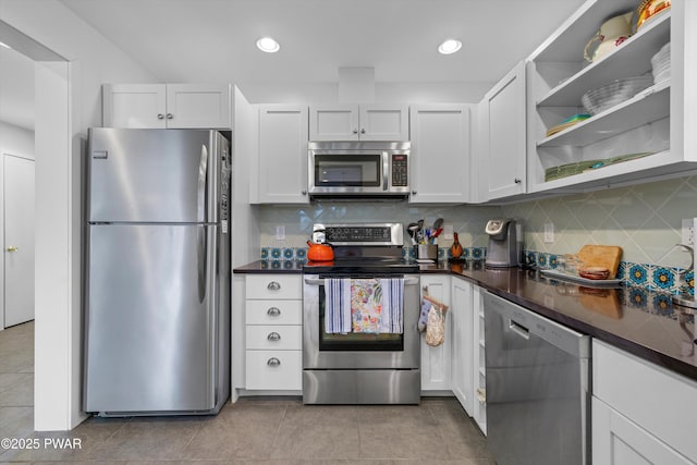 105 Tupelo Dr, Lords Valley, PA 18428 - kitchen with stainless steel appliances, dark countertops, white cabinetry, decorative backsplash, and recessed lighting