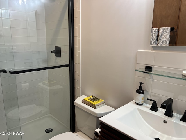 bathroom with a shower with door, toilet, and vanity