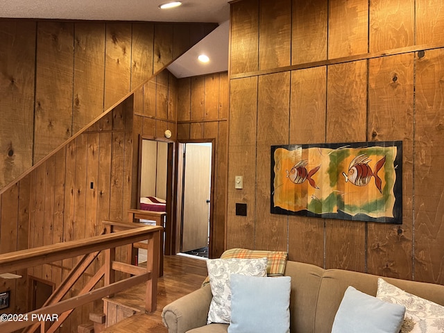 interior space featuring hardwood / wood-style flooring and wooden walls