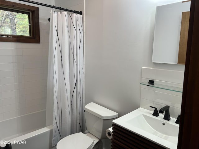 full bathroom with vanity, toilet, and shower / bath combo