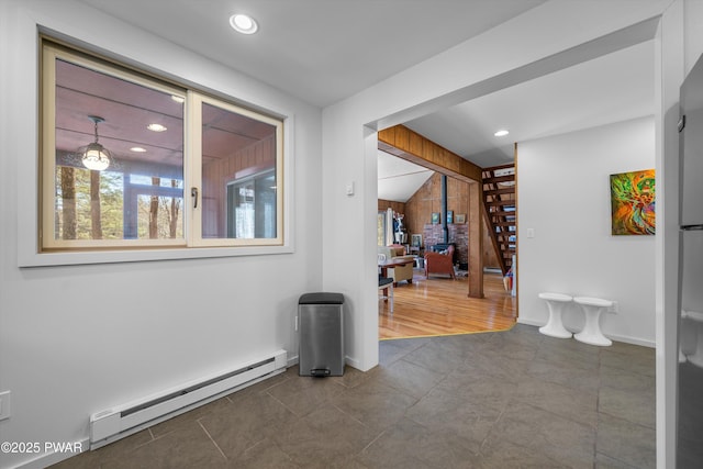 105 Tupelo Dr, Lords Valley, PA 18428 - hall featuring a baseboard radiator, wood walls, stairway, recessed lighting, and dark tile patterned flooring