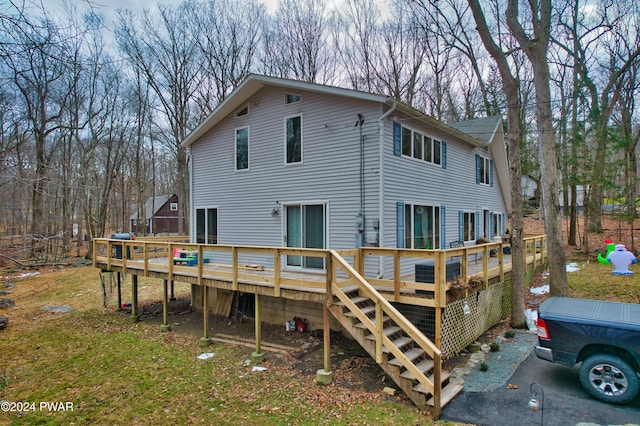 back of property with a wooden deck