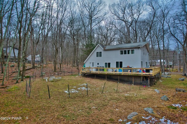 back of property featuring a deck