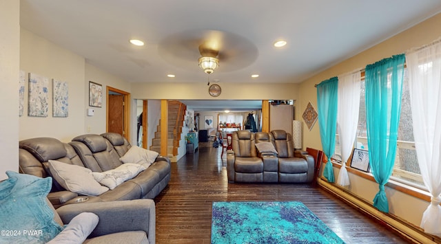 living room with ceiling fan and dark hardwood / wood-style floors