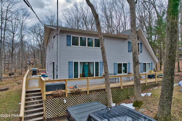 rear view of house with a deck