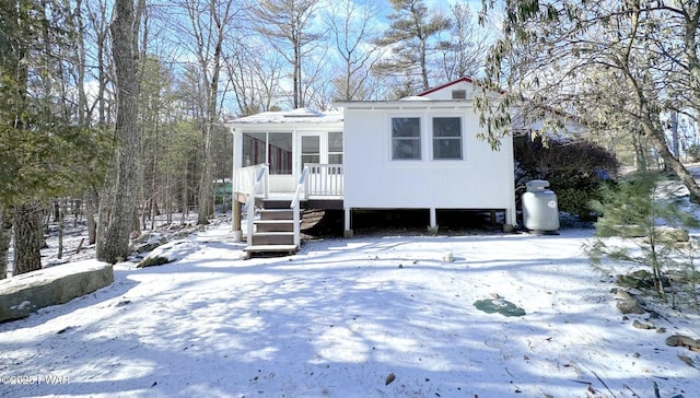 view of front of house featuring a sunroom