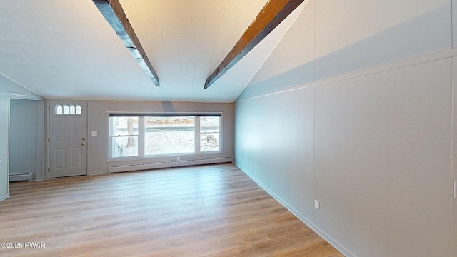 empty room with lofted ceiling with beams, light hardwood / wood-style floors, and a baseboard radiator