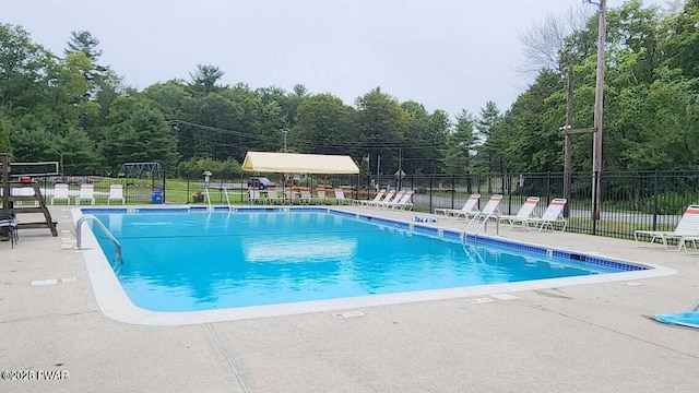 view of swimming pool featuring a patio area