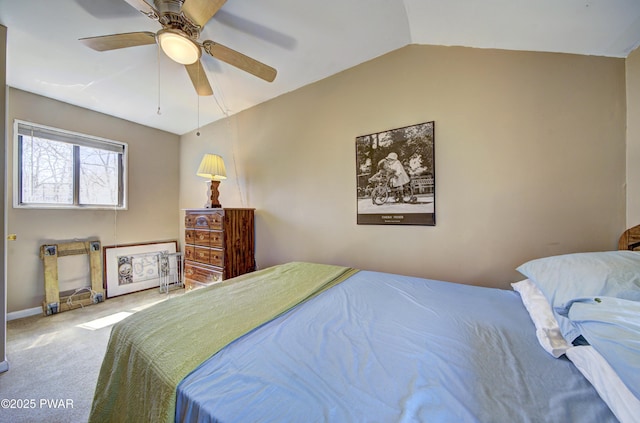 bedroom featuring vaulted ceiling, carpet, and ceiling fan