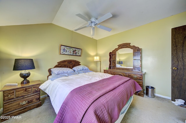 bedroom with carpet floors, a ceiling fan, vaulted ceiling, and baseboards