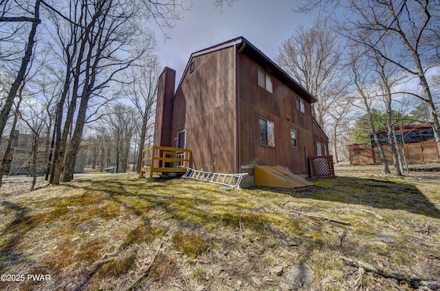view of side of home with a chimney