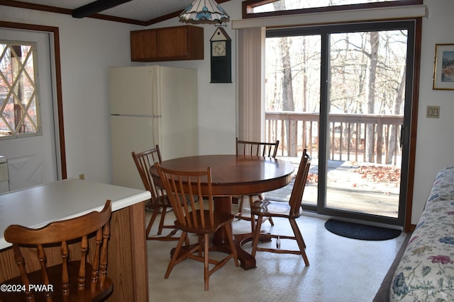 dining room with beam ceiling