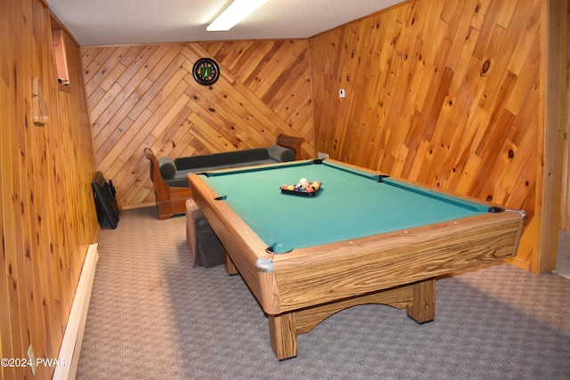 game room with light carpet, a textured ceiling, wooden walls, and billiards