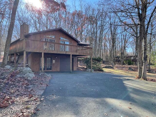 view of front of property featuring a wooden deck