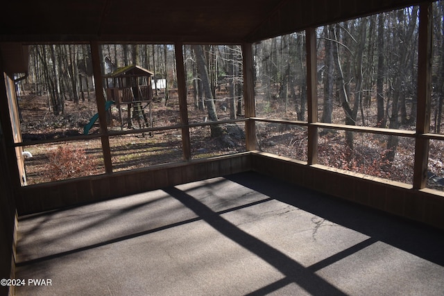 unfurnished sunroom with vaulted ceiling