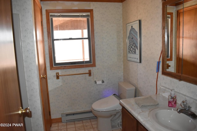 bathroom with vanity, toilet, and baseboard heating