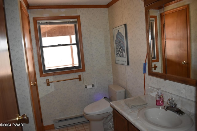 bathroom featuring crown molding, toilet, vanity, and a baseboard heating unit