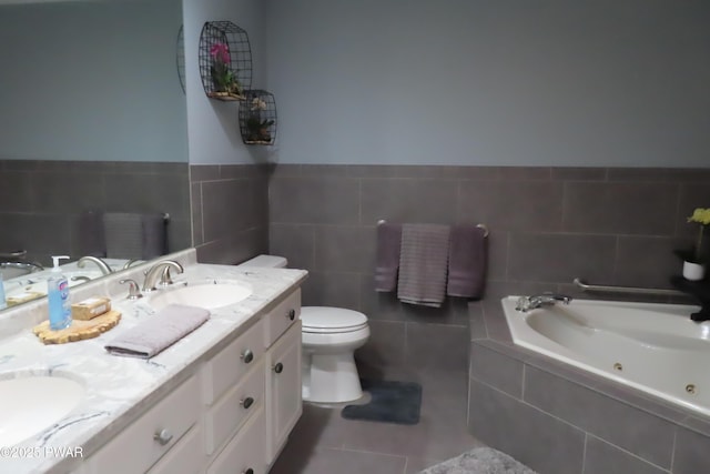 full bath featuring tile patterned flooring, toilet, a sink, double vanity, and a tub with jets