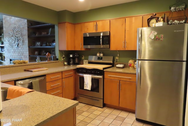 kitchen featuring appliances with stainless steel finishes, light countertops, and light tile patterned flooring