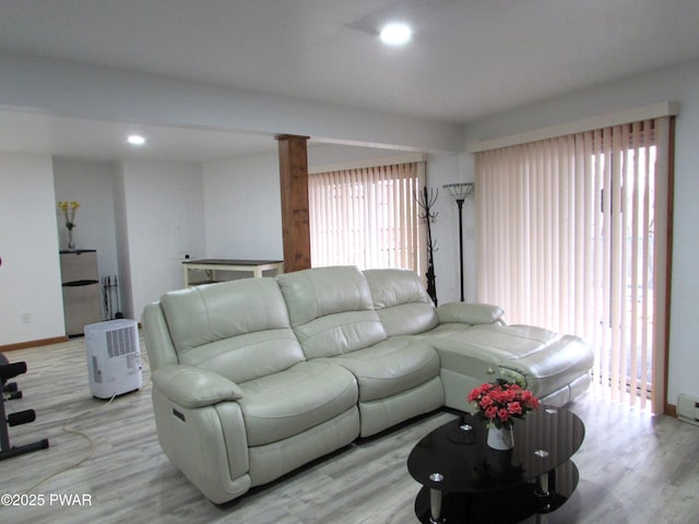 169 N Lake Dr, Dingmans Ferry, PA 18328 - living room featuring light wood-style flooring, ornate columns, baseboards, and recessed lighting