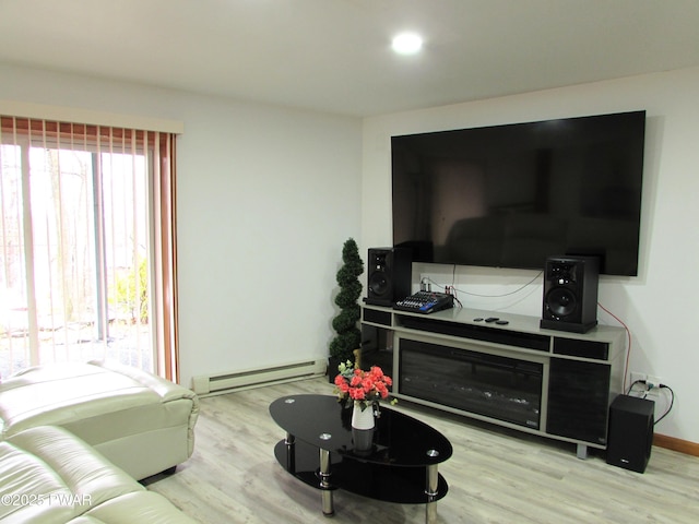 169 N Lake Dr, Dingmans Ferry, PA 18328 - living area featuring a baseboard radiator, baseboards, and wood finished floors