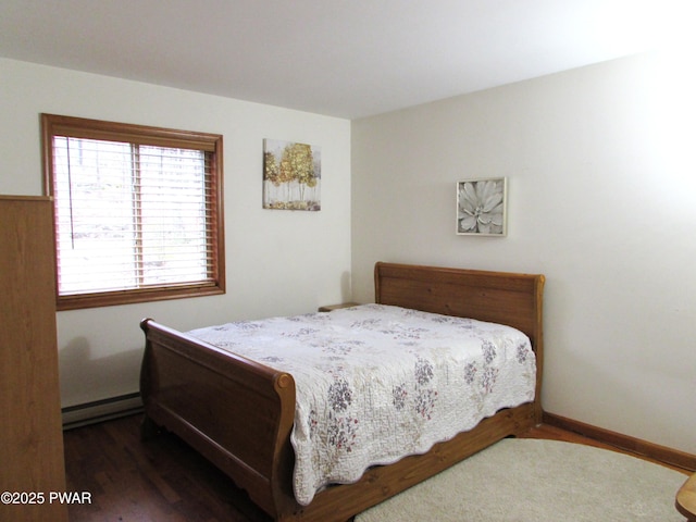 169 N Lake Dr, Dingmans Ferry, PA 18328 - bedroom featuring a baseboard heating unit and wood finished floors