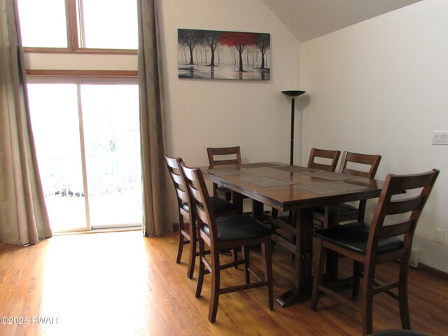 169 N Lake Dr, Dingmans Ferry, PA 18328 - dining area featuring wood finished floors and lofted ceiling