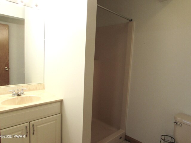 169 N Lake Dr, Dingmans Ferry, PA 18328 - bathroom with toilet, vanity, and a stall shower