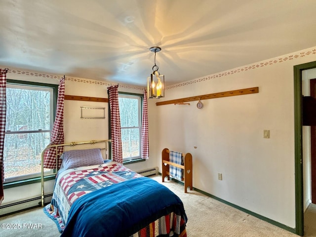 carpeted bedroom with a baseboard radiator