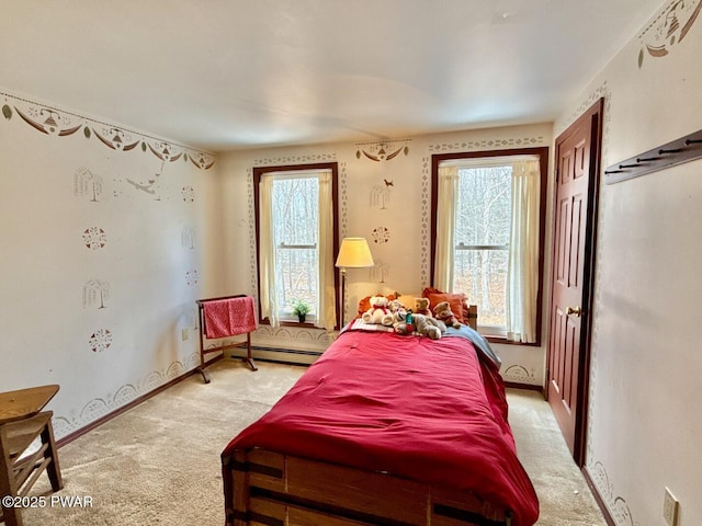 carpeted bedroom featuring baseboard heating